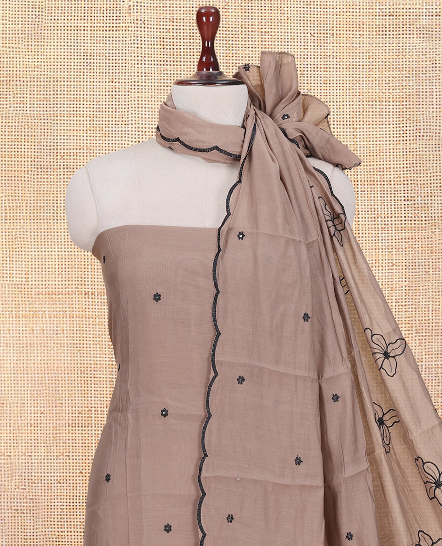 Light Brown Mul Chanderi Material Churidar Features Floral Thread Embroidered Top, a Matching Bottom, and an Scallop Embroidered Dupatta