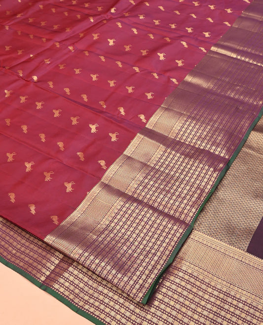 Maroon Vasundhara Lite Silk Mix Saree, Embellished with Zari Buttas All Over Its Body, Complemented by Contrast Border of Rekku, Kathir, Poun, Ara Maadam, and Geometric Patterns, Grand Pallu and Paired with a Contrast Blouse