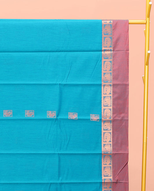 Blue Semi-Silk Cotton Saree, Decked Up with Zari Buttas All Over Its Body, Complemented by a Contrast Kal Eragina Border of Peacock Designs, Pallu Steeped with Elephant Zari Motifs, and Paired with a Matching Blouse