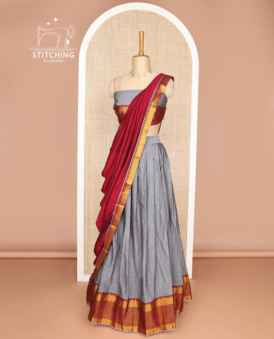 Grey cotton half saree with contrast checked, temple border, zari design blouse & temple border dhavani