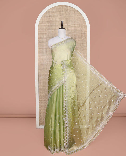 Green Designer Saree, Gleamed Up with Stone Embroidered Buttas on Its Body, Highlighted by Scallop Stone Work Border, Pallu of Stone Work, and Paired with a Heavily Stone Embellished Matching Blouse