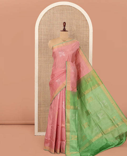Pink Uppada Silk Saree Adorned with Parrot Zari Buttas, Complemented by Bavanji Border, Contrast Pallu Steeped with Parrot Zari Designs, and Paired with a Contrast Blouse