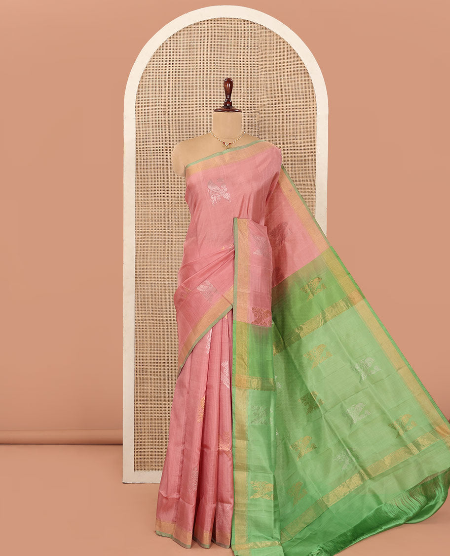 Pink Uppada Silk Saree Adorned with Parrot Zari Buttas, Complemented by Bavanji Border, Contrast Pallu Steeped with Parrot Zari Designs, and Paired with a Contrast Blouse
