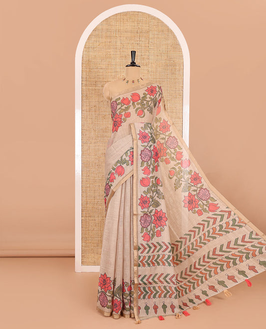 Chikku plain linen cotton saree, floral creeper printed zari piping border, geometric printed pallu, and lotus printed blouse