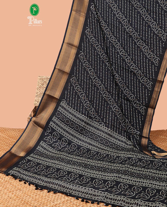 Black all-over bandani print dola silk saree with contrast copper thread gatt border & bandhani print blouse