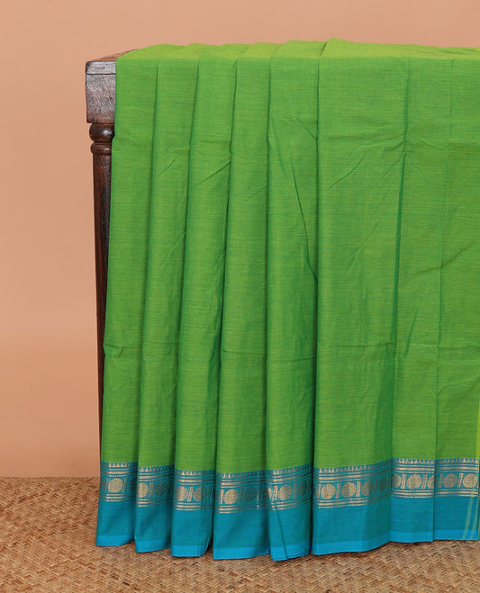 Green plain Chettinad cotton saree, contrast temple traditional ganga jamuna border, and striped pallu