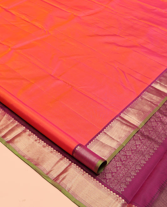 Orange Plain Kanchipuram Silk Saree, a Contrast Border of Thilakam Mokku, Banaras, Muthu, and Mayil Kann Designs, Intricately Patterned Pallu, and a Contrast Blouse