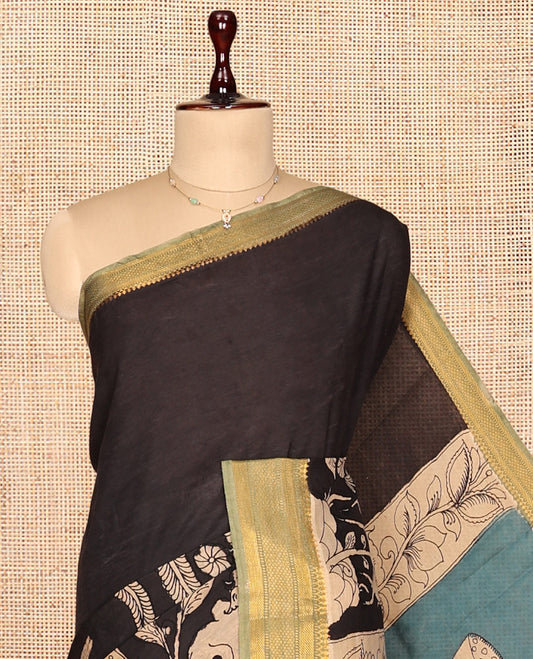 Black Kalamkari Silk Saree, Impeccably Styled with Animal and Human Figurines, a Contrast Traditional Zari Border, Pallu of Kalamkari Design, and a Contrast Blouse