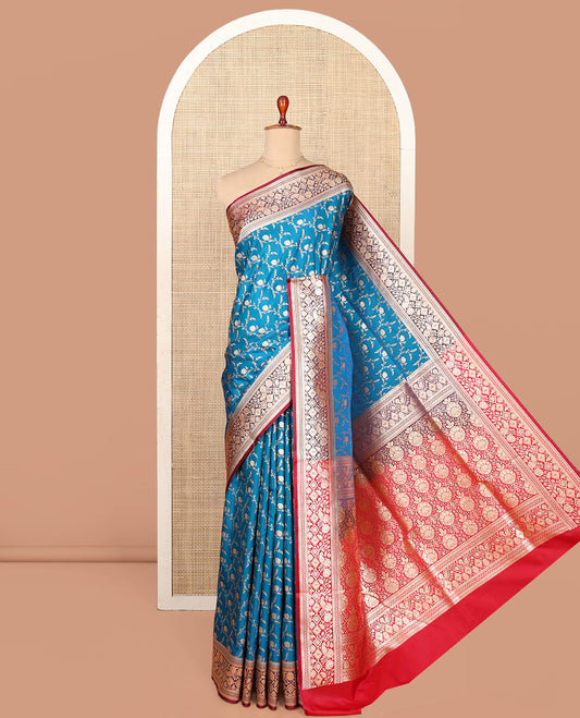 Blue Semi-Banaras Saree, Mesmerized with Jaal Jacquard on Its Body, Complemented by a Contrast Floral, Paisley, and Geometric Design Border, Intricately Designed Pallu, and Paired with a Contrast Blouse