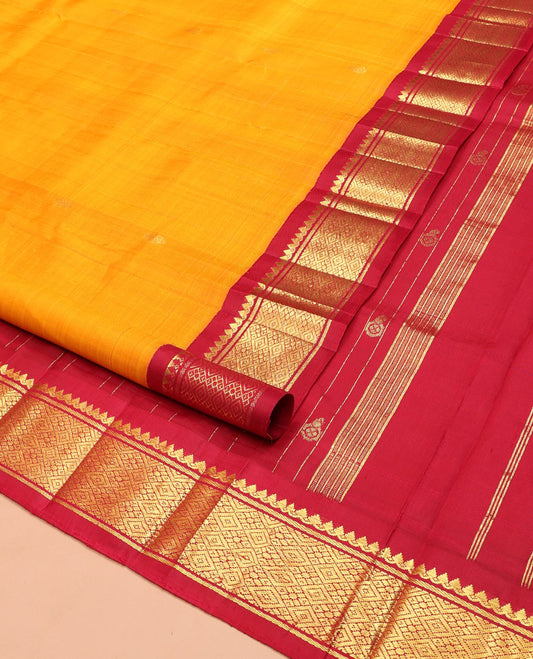 Yellow Kanchipuram Silk Saree, Sparsely Woven with Zari Buttas on Its Body, Complemented by Contrast One-Sided Korvai Border of Thilakam Mokku, Banaras, and Jaal Designs, Pallu Features Zari Designs, and Comes Without a Blouse