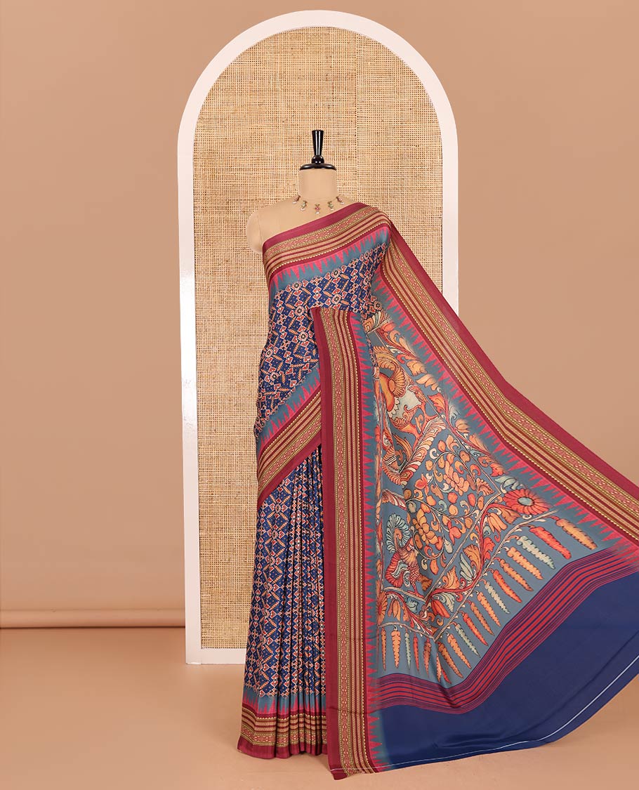 Blue patola style geometric printed Italian Crepe saree, contrast temple ikkat printed border, Kalamkari printed pallu, and a printed bordered blouse