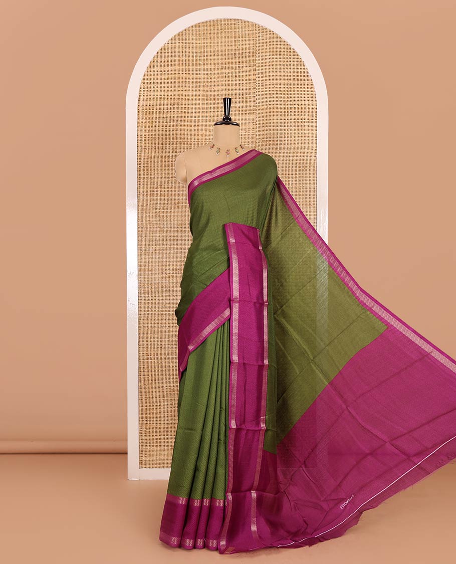 Olive green embossed moss chiffon saree, contrast traditional rettai pettu border, embossed pallu, and a contrast embossed blouse