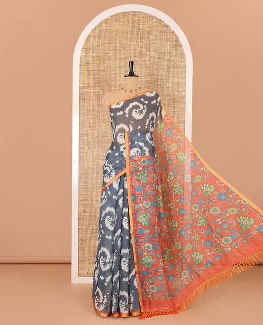 Borderless grey shibori printed linen cotton saree, contrast kaleidoscope colored kalamkari floral vine print, and a contrast printed blouse