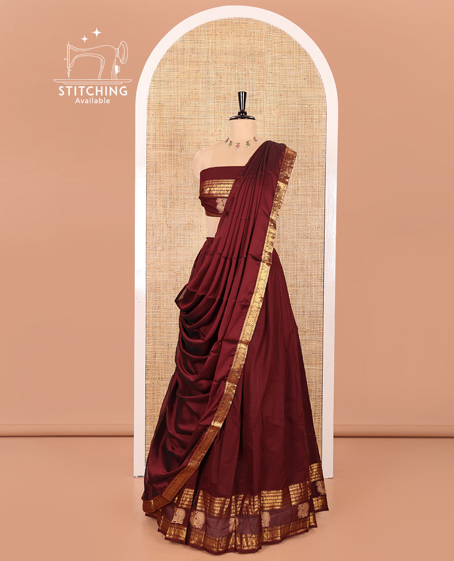 Maroon Chettinad Cotton Half-Saree Featuring Plain Skirt, Elevated with a Contrast Traditional Zari Border of Peacock Designs, Paired with a Matching Blouse, and a Satin Georgette Zari Bordered Dhavani