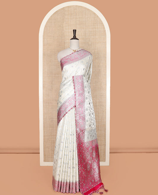 Pearl white floral jaal jacquard banarasi silk saree, contrast floral creeper stone work border, and pallu of intricate designs and stone work