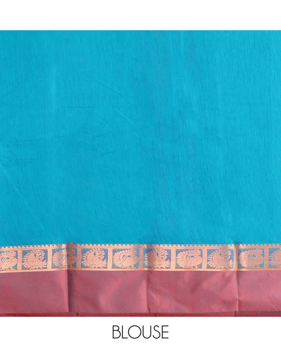 Blue Semi-Silk Cotton Saree, Decked Up with Zari Buttas All Over Its Body, Complemented by a Contrast Kal Eragina Border of Peacock Designs, Pallu Steeped with Elephant Zari Motifs, and Paired with a Matching Blouse