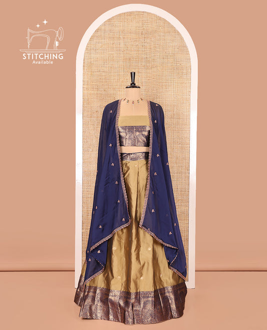 Liril Green and Blue Semi-Banarasi Half-Saree, Delicately Woven with Zari Buttas on Its Skirt, Complemented by a Contrast Geometric Patterns Zari Woven Border, Paired with a Matching Blouse, and a Contrast Satin Georgette Embroidered Scallop Dhavani