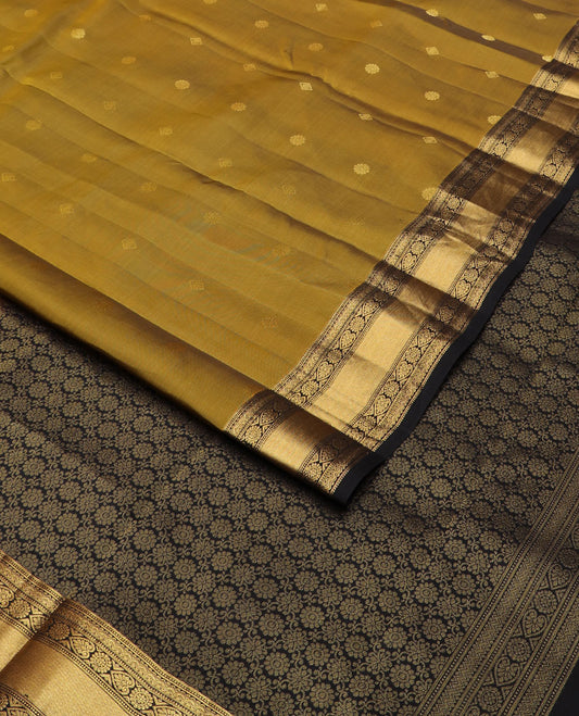 Green buttas vasundhara silk mix saree, contrast chakra motifs pallu & border of muthu,rettai neli poun,banaras,kattari,jadai nagam