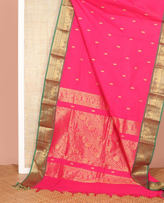 Pink Chettinad Cotton Saree Accentuated with Zari Buttas All Over Its Body, Complemented by a Contrast Border of Traditional Zari Designs, and Pallu Features Floral Creeper and Jaal Design