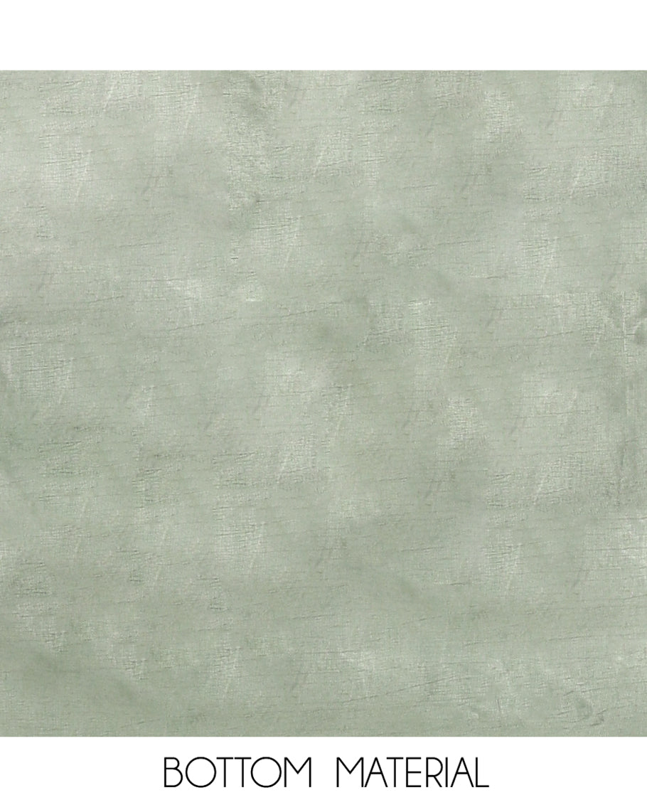 Green Banarasi Material Chudidar Features Jacquard Top, a Matching Santoon Bottom, and an Intricately Designed Dupatta