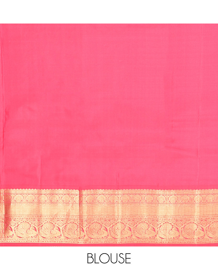Brown Vasundhara Silk Saree, Decorated with Zari Buttas on Its Body, Complemented by a Contrast Traditional Zari Border of Mayil Designs, Grand Pallu Depicts Jaal and Floral Designs, and Paired with a Contrasting Blouse