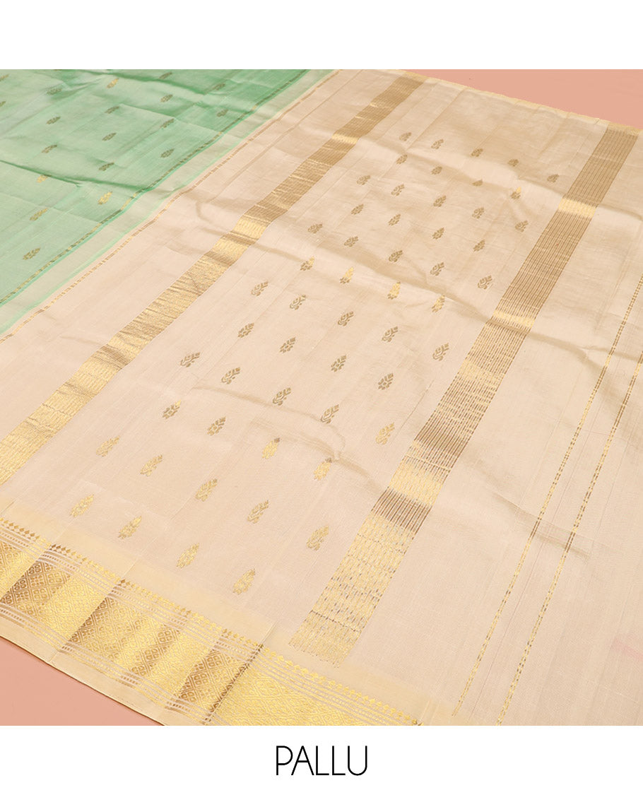 Green Kanchipuram Silk Saree, Featuring Zari Buttas, a Contrast One-Sided Border of Panner Sombu, Muthu, Banaras, and Jaal Design, Zari Design Pallu, and No Blouse