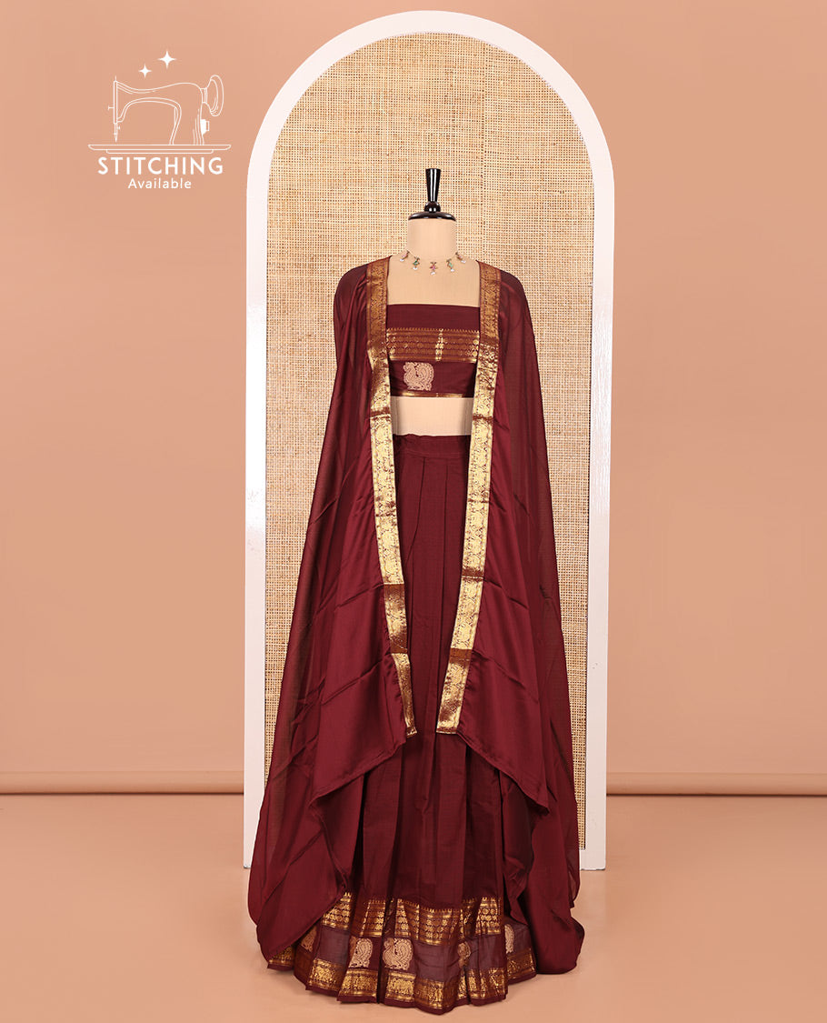 Maroon Chettinad Cotton Half-Saree Featuring Plain Skirt, Elevated with a Contrast Traditional Zari Border of Peacock Designs, Paired with a Matching Blouse, and a Satin Georgette Zari Bordered Dhavani