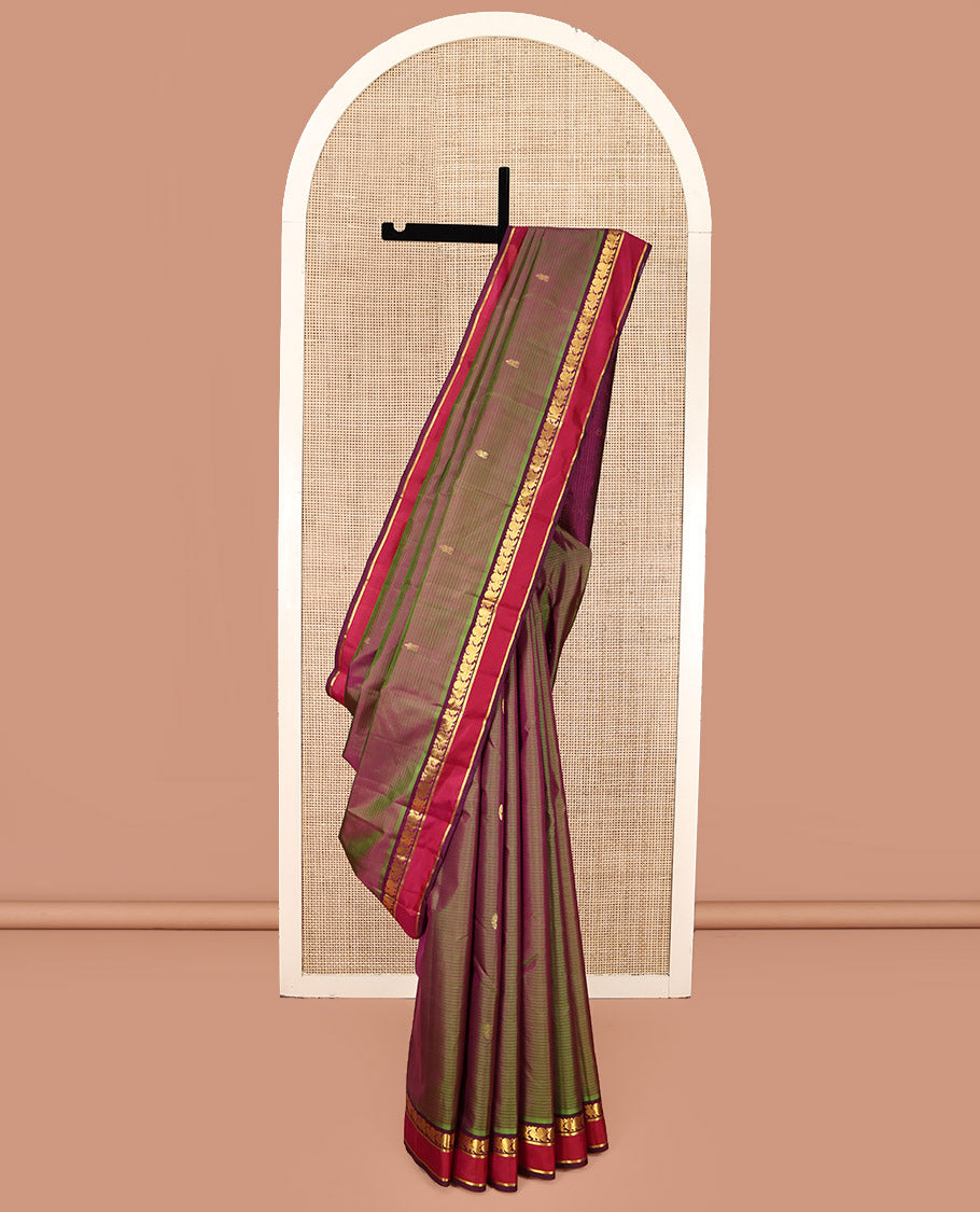 Green Kanchipuram Silk Saree, Sparsely Sparkled with Vazhaipoo Stripes and Zari Buttas on Its Body, Complemented by Contrast Rettai Pettu Border of Mayil, and Kathir Designs, Zari-Striped Pallu, and Paired with a Contrast Blouse