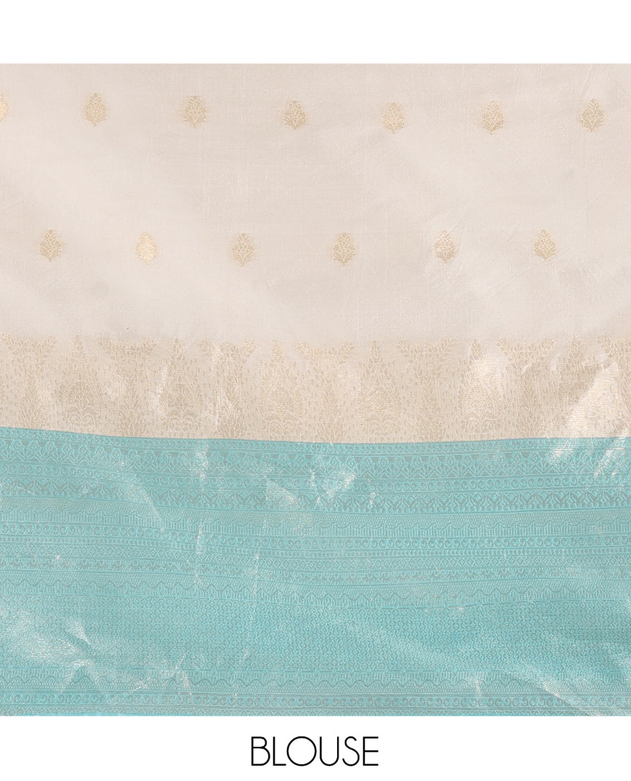 Cream-Blue Semi-Silk Half-Saree, Subtly Sparkled with Zari Buttas Skirt, a Contrast Traditional Zari Border, and a Contrast Dhavani