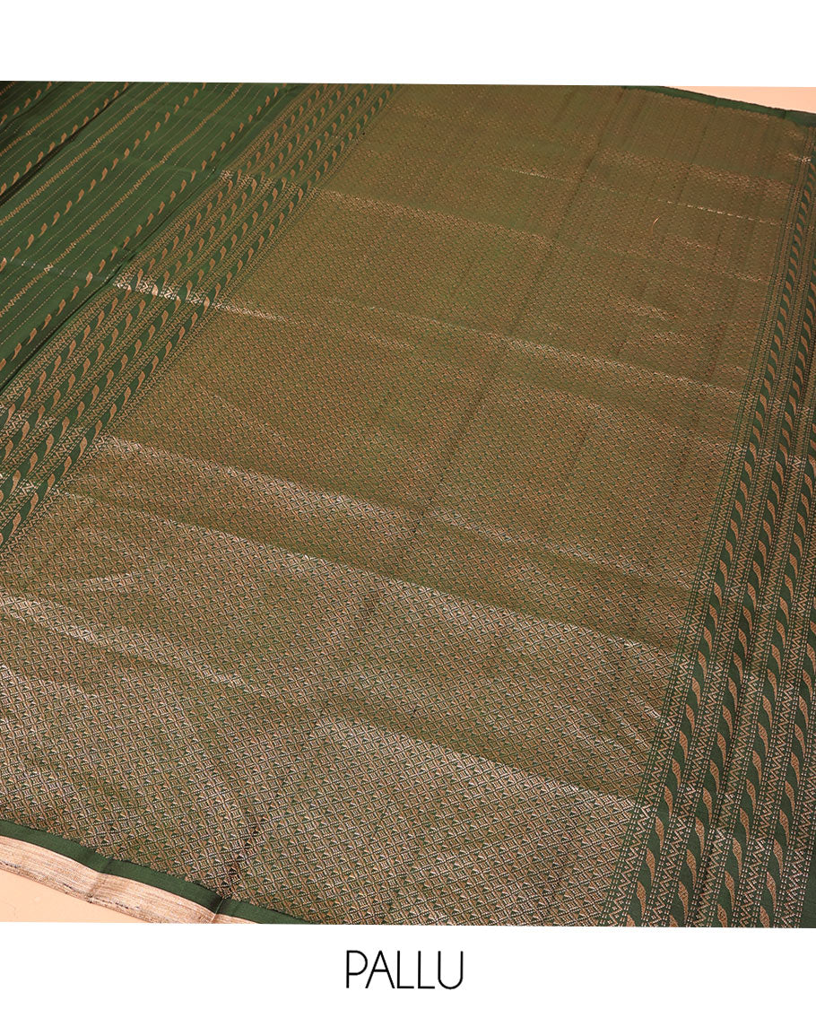 Green Mayuri Soft Silk Saree, Mesmerized with Neli, and Muthu Designs  All Over Its Body, Highlighted by Zari Border of Peacock Designs, Boldly Accentuated Jaal Pallu, and Paired with a Matching Blouse