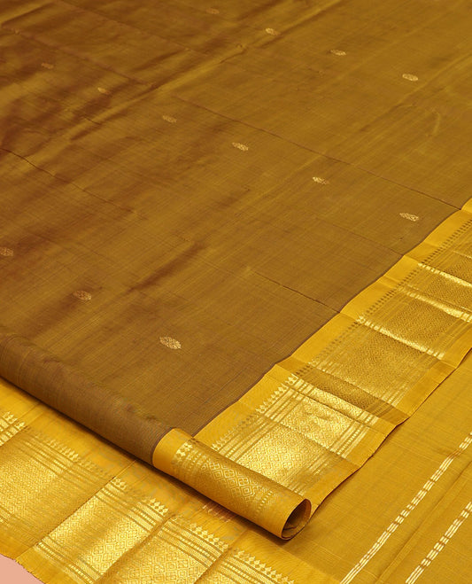 Green Kanchipuram Silk Saree, Elevated with Zari Buttas, a Contrast One-Sided Border of Paneer Sombu, Banaras, Muthu, and Jaal Designs, a Zari Design Pallu, and No Blouse
