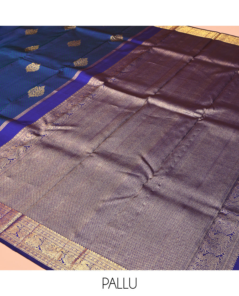 Blue Parampara Silk Saree, Graced with Zari Buttas and Embossed Texture On Its Body Highlighted by Zari Border of Muthu, Poun, and Mayil Designs, Pallu of Ara Maadam Designs, and Paired with a Matching Blouse