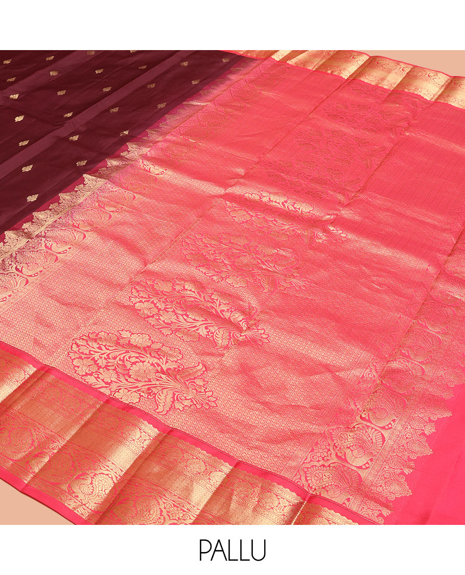 Brown Vasundhara Silk Saree, Decorated with Zari Buttas on Its Body, Complemented by a Contrast Traditional Zari Border of Mayil Designs, Grand Pallu Depicts Jaal and Floral Designs, and Paired with a Contrasting Blouse