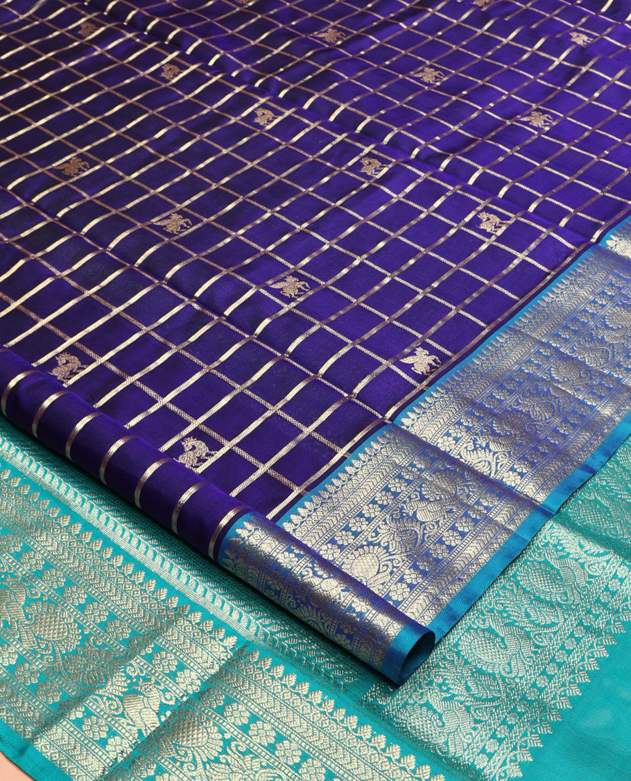 Blue Venkatagiri Silk Saree, Gleamed Up with Zari Butta Enclosed Checks All Over Its Body, Complemented by a Contrast Traditional Zari Design Border, Pallu of Traditional Designs, and Paired with a Contrast Blouse
