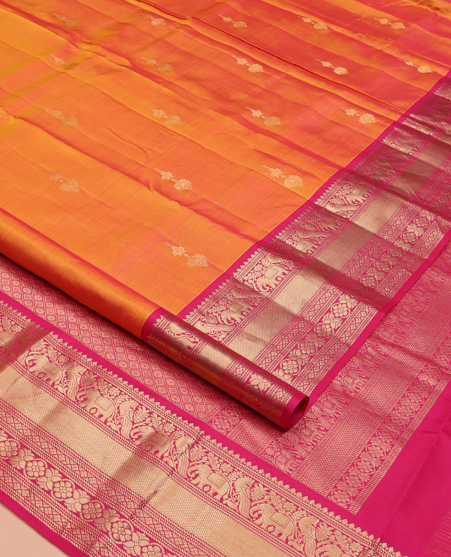 Orange Vasundhara Silk Saree, Entralled with Zari Buttas All Over Its Body, Complemented by Contrast Border of Mayil, Yaanai, Diamond and Floral Designs Grand Jaal Pallu and Paired with a Contrast