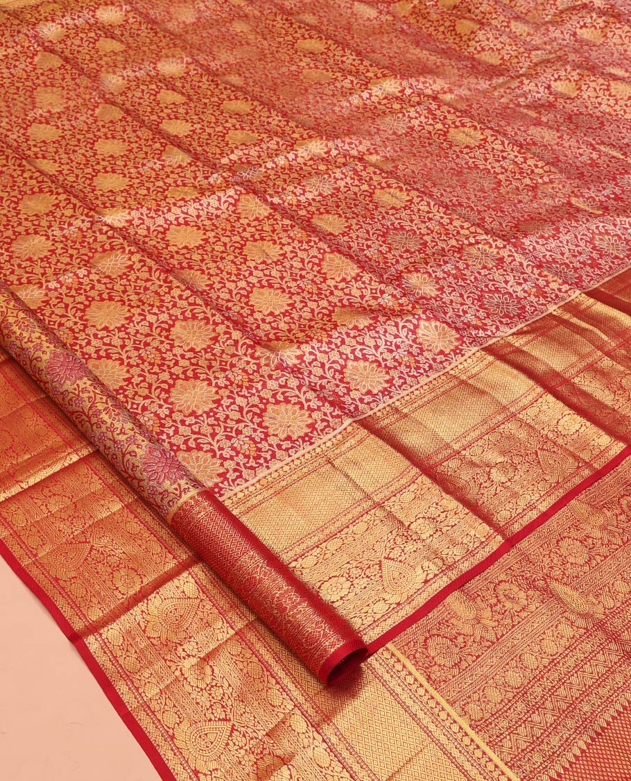 Red Kanchipuram Tissue Silk Saree, Gracefully Embellished with Jacquard Designs on Its Body, Highlighted by a Zari Border of Traditional Designs, Intricately Designed Pallu, and Paired with a Matching Blouse