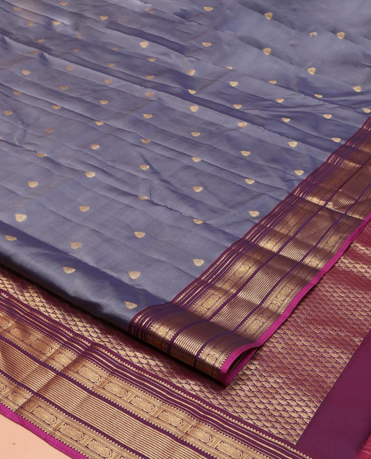 Grey Vasundhara Lite Silk Mix Saree, Elevated with Zari Buttas on Its Body, Complemented by Contrast Border of Rekku, Banaras, and Meen Designs, Grand Pallu Steeped with Paisleys, and Paired with a Contrast Blouse