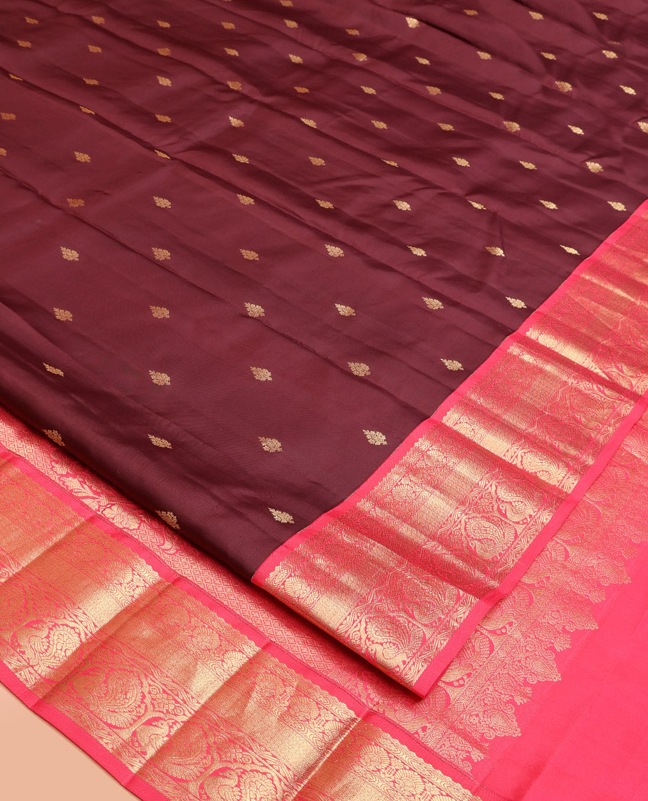 Brown Vasundhara Silk Saree, Decorated with Zari Buttas on Its Body, Complemented by a Contrast Traditional Zari Border of Mayil Designs, Grand Pallu Depicts Jaal and Floral Designs, and Paired with a Contrasting Blouse
