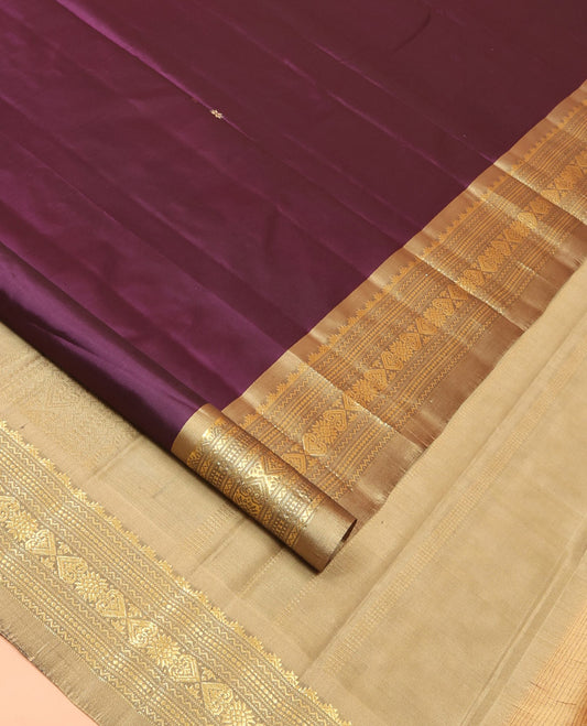Purple Kanchipuram Silk Saree Prettified with Zari Buttas, Complemented by a Contrast Border Featuring Thazampoo Rekku, Neli, Muthu, and Jada Nagam Designs, Sparsely Woven Pallu, and Paired with a Contrast Blouse
