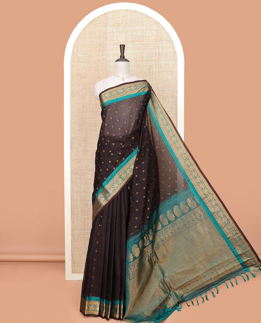Brown Gadwal Saree Adorned with All-Over Buttas, Contrast Border Features Traditional Motifs, Pallu Elevated with Zari, and a Contrast Blouse of Zari Border