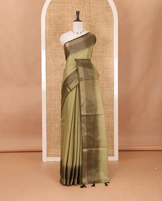 Olive green plain tissue saree, contrast gold zari piping border & self pallu with tussels