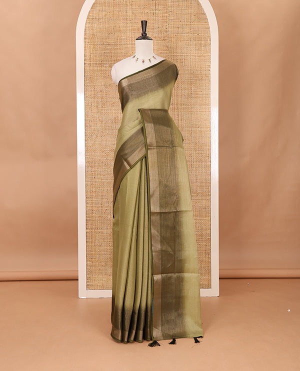 Olive green plain tissue saree, contrast gold zari piping border & self pallu with tussels