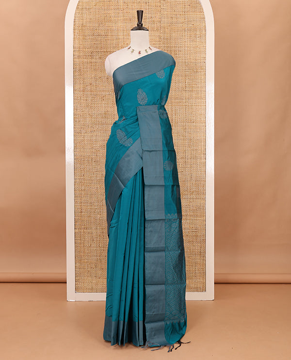 Peacock green butta silk cotton , contrast bawanchi border & thread weaving rich pallu with tussels