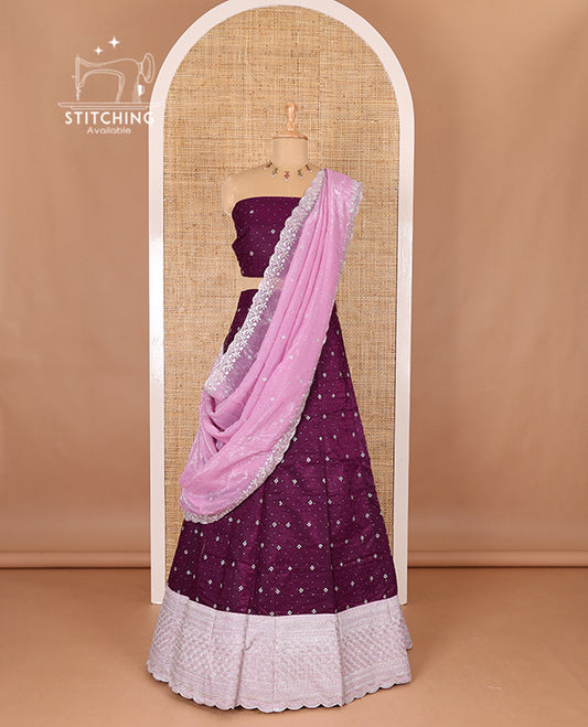 Purple half-saree, floral motifs embroidered semi raw silk top, matching embroidered blouse, and contrast scallop embroidered georgette dhavani