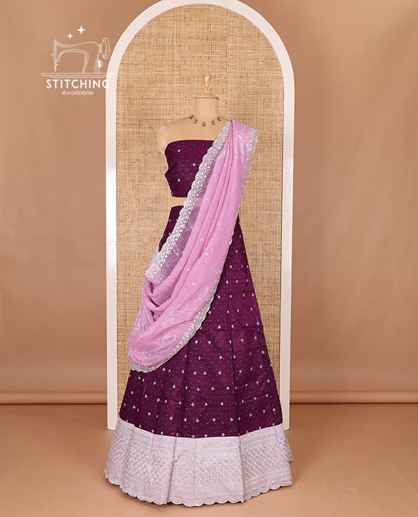 Purple half-saree, floral motifs embroidered semi raw silk top, matching embroidered blouse, and contrast scallop embroidered georgette dhavani