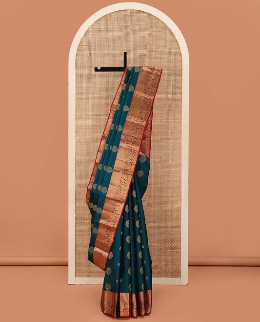 Blue Vasundhara Lite Silk Mix Saree Richly Detailed with Floral Zari Buttas, Complemented with a Contrast Border Featuring Salngai, Mayil Kann, Kathir, and Kodi Visiry Designs, Pallu Decked Up with Floral Designs, and Paired with a Contrast Blouse