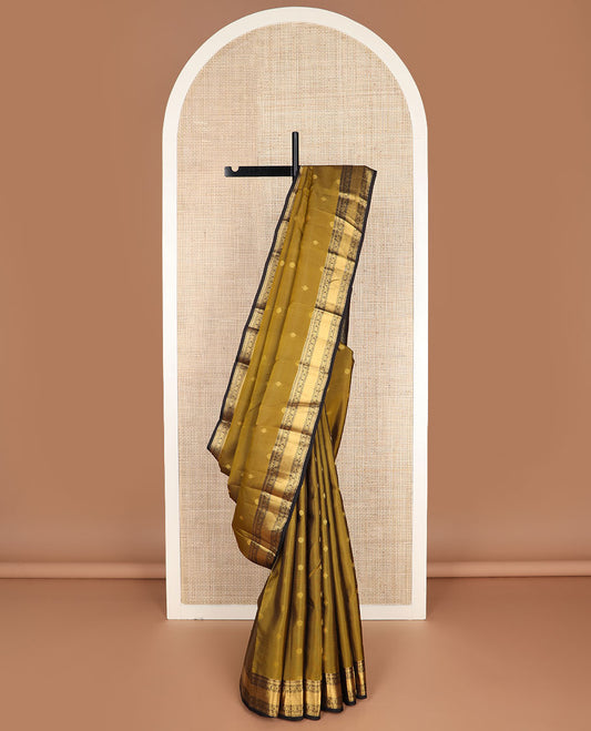 Green buttas vasundhara silk mix saree, contrast chakra motifs pallu & border of muthu,rettai neli poun,banaras,kattari,jadai nagam