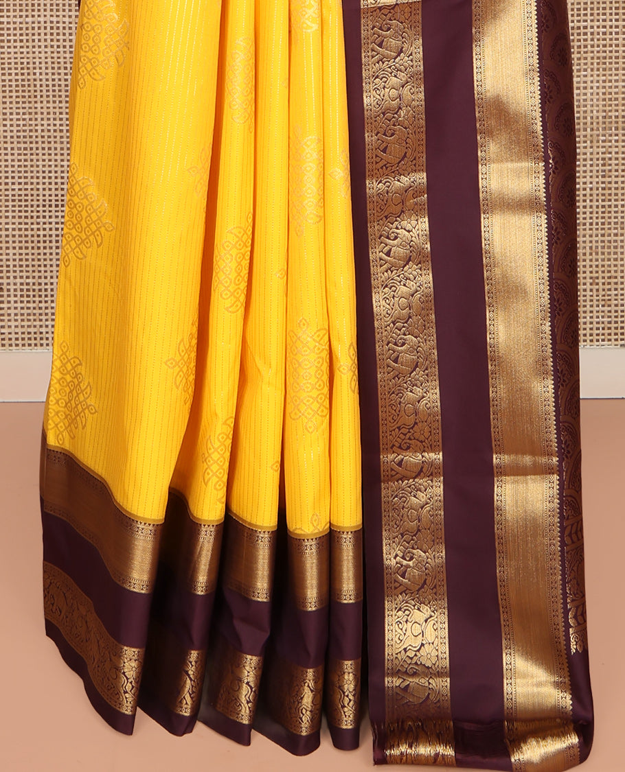 Yellow Budget Silk Saree, Embellished with Zari Stripes and Kolam Buttas All Over Its Body, Complemented by a Contrast Traditional Zari Design Rettai Pettu Border, Grand Scallop Design Pallu, and Paired with a Contrast Blouse