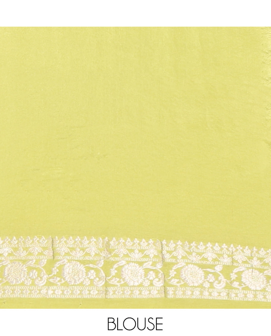 Green Fancy Crepe Saree, Gleamed Up with Thilakam Buttas, Highlighted by a Traditional Border, Intricately Designed Pallu, and a Matching Blouse
