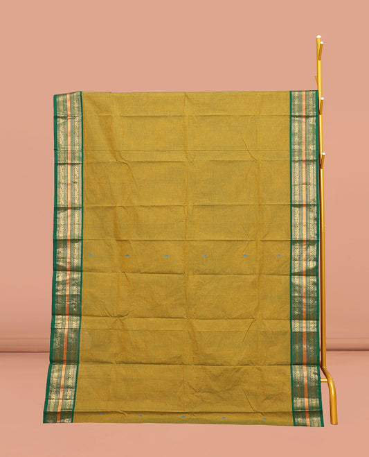 Green Chettinad Cotton Saree, Subtly Woven with Thread Buttas All Over Its Body, Complemented by Contrast Traditional Zari Design Border, Pallu of Stripes, and Buttas and Paired with a Matching Blouse
